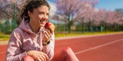 Female Athlete with Apple Image Female Athlete with Apple Image